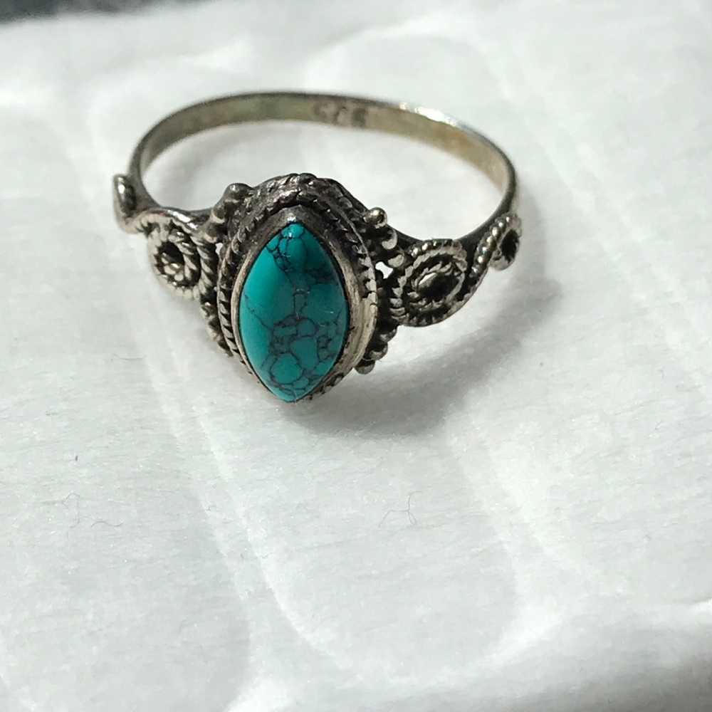 Turquoise ring with swirled detailing on the band